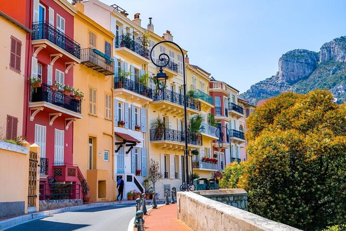 a city street with colorful buildings on a hill