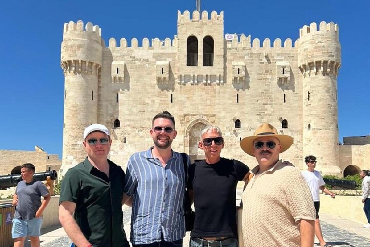 a group of people standing in front of a castle