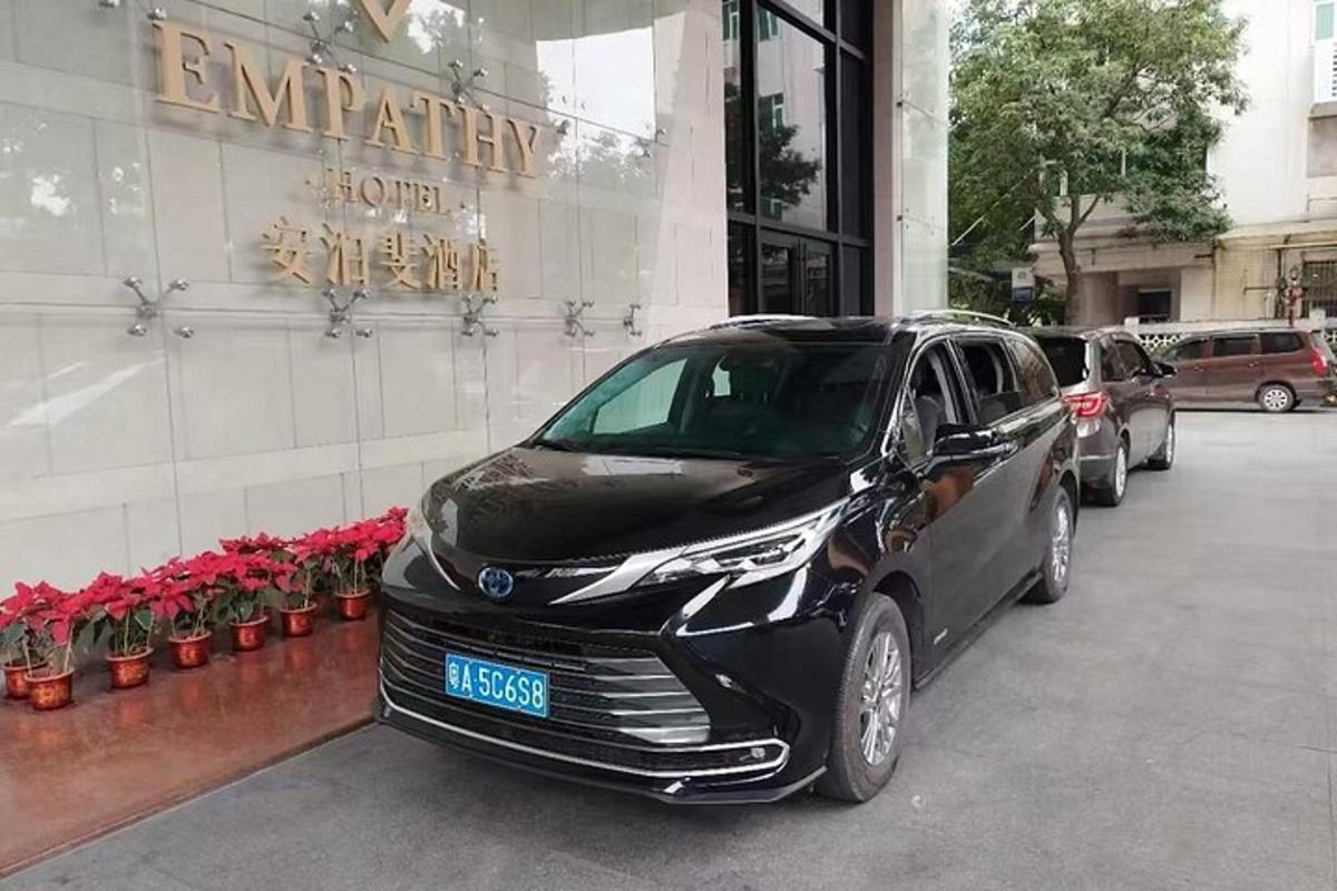 a black car parked in front of a building