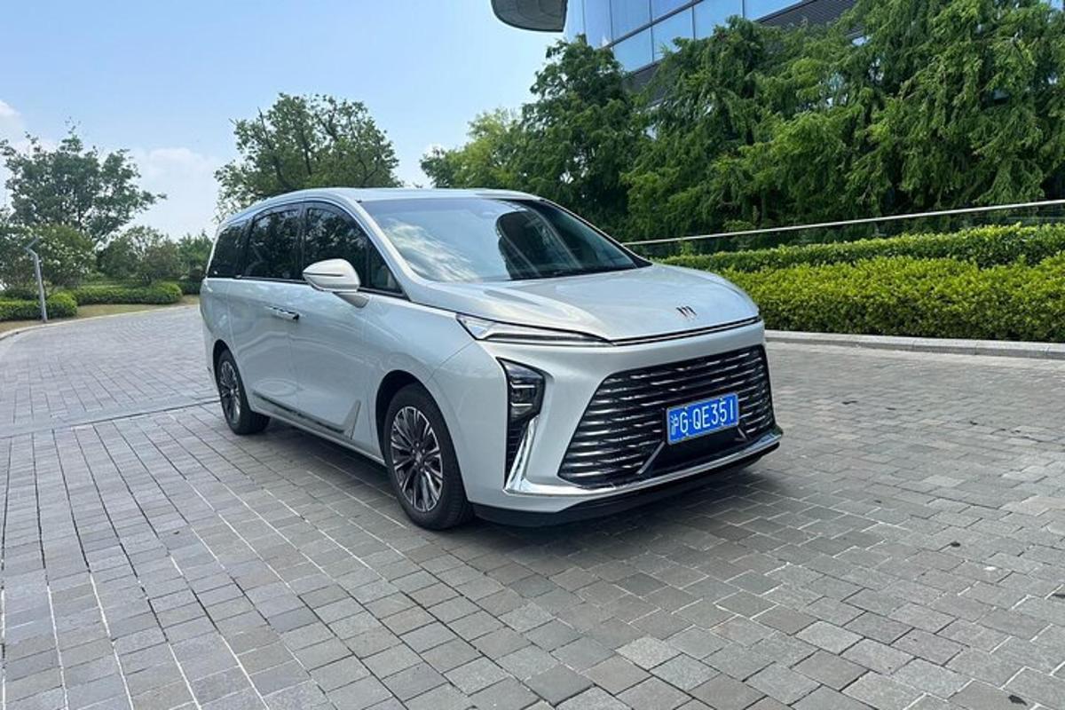 a silver car is parked on a street
