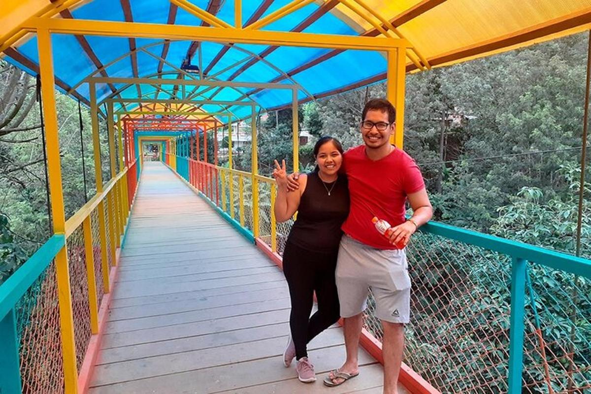 a man and a woman standing on a bridge