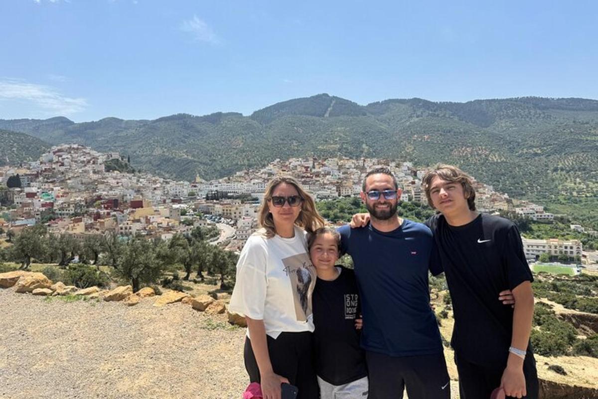 a group of people standing on top of a mountain