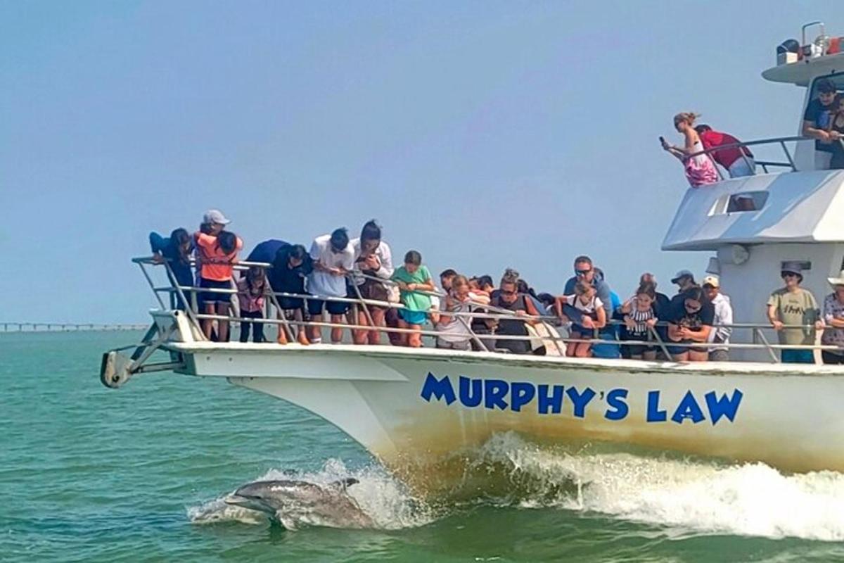 a group of people on a boat in the water