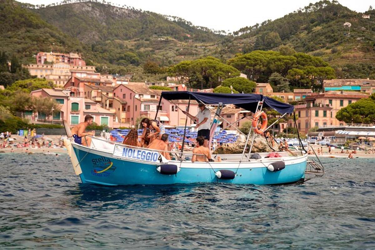 a group of people on a blue boat in the water