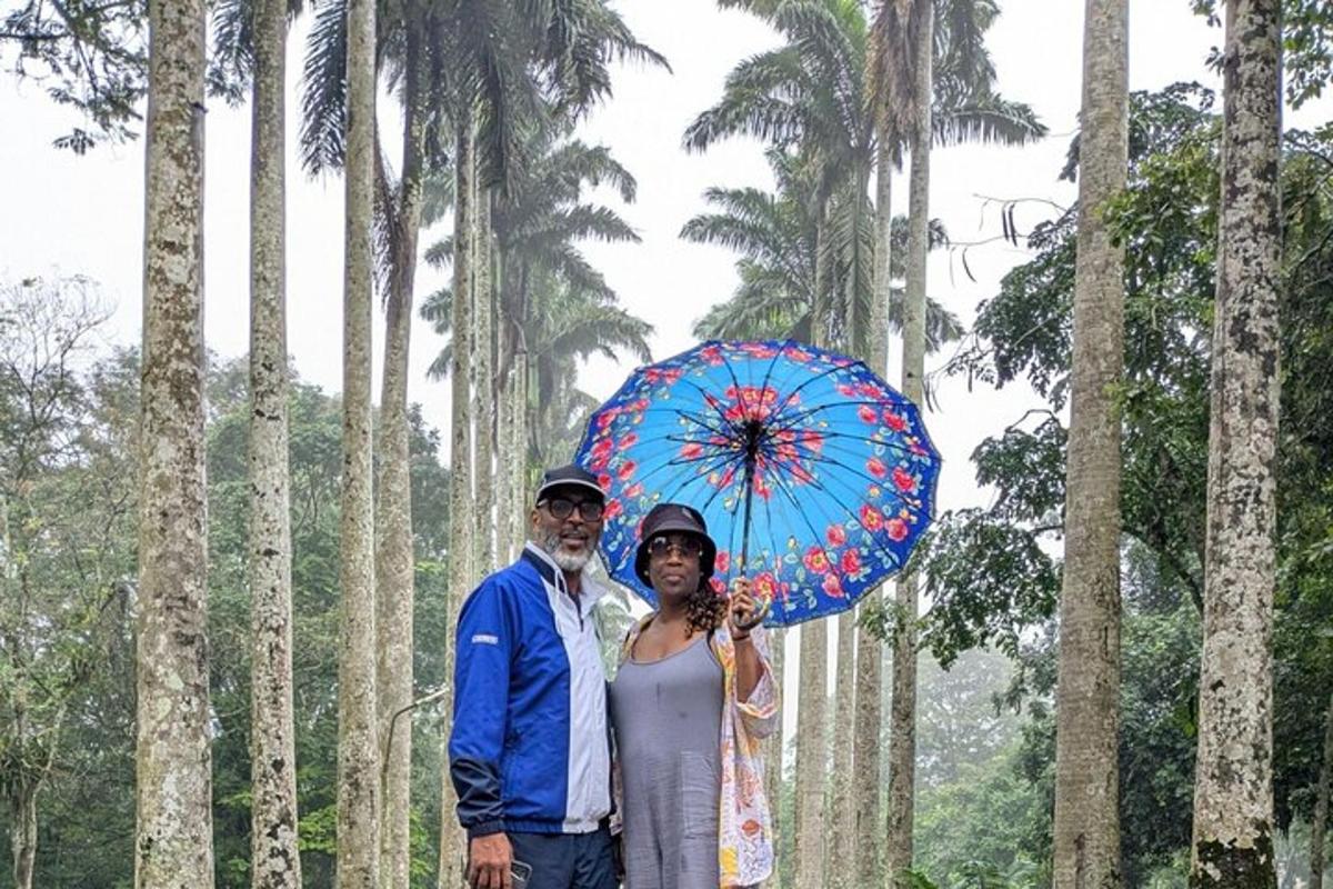 a man and a woman holding a blue umbrella