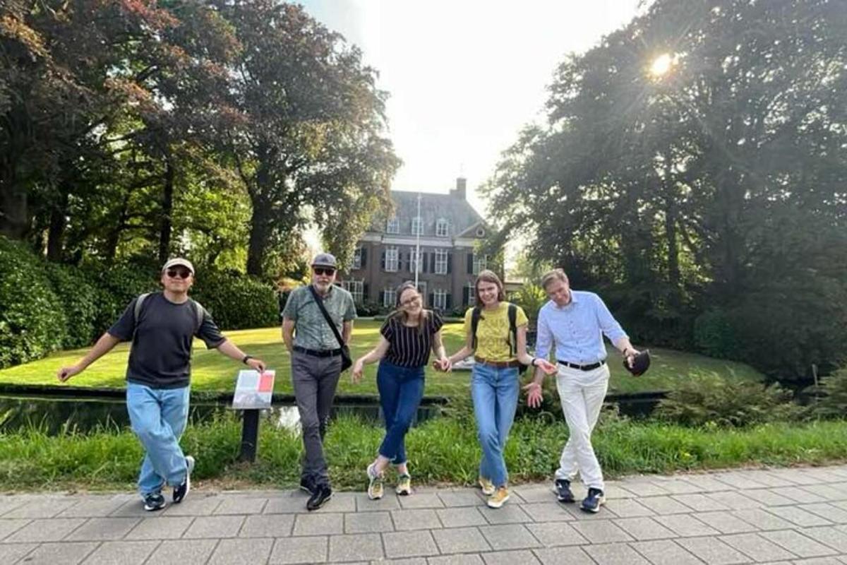 a group of people walking in front of a house