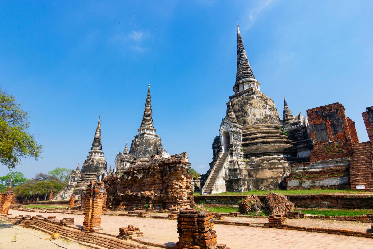 a temple in ayutthaya province of thailand with a clear blue sky