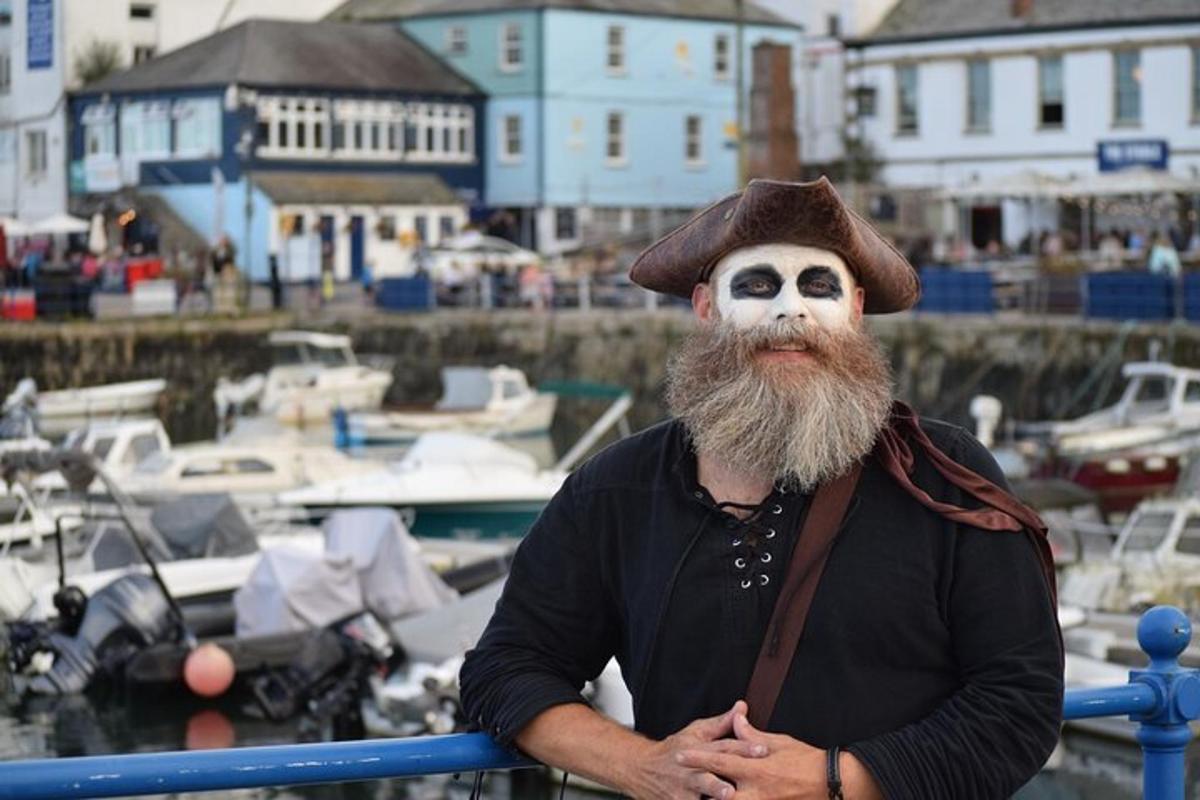 a man with a white face with ahat on