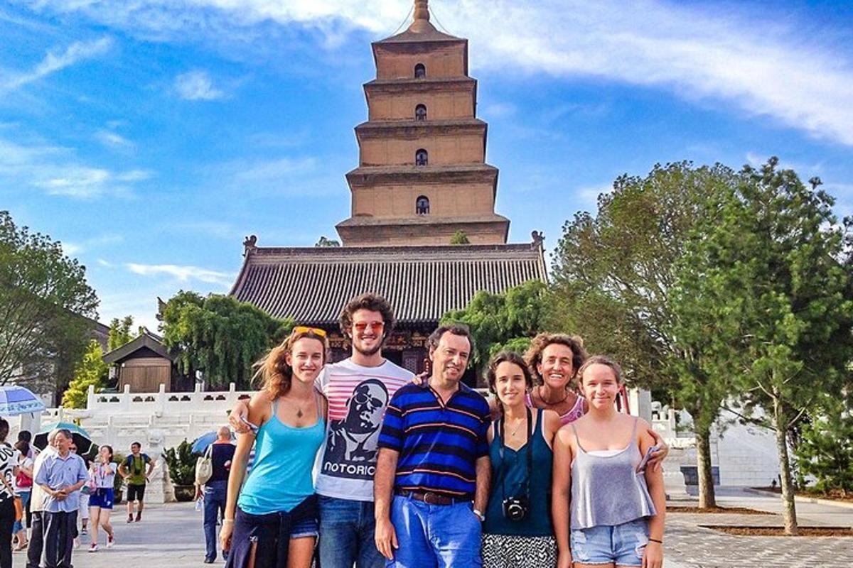 a group of people standing in front of a tower