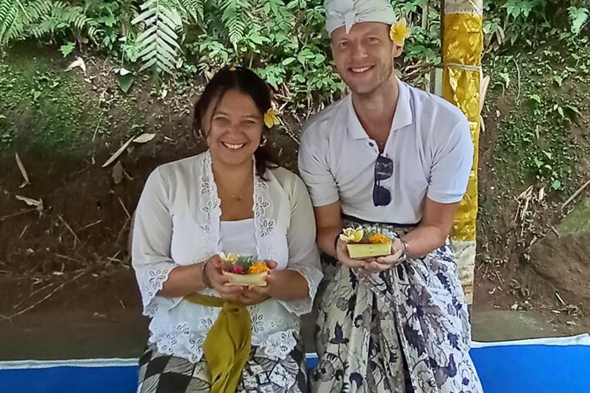 a man and a woman holding food in their hands