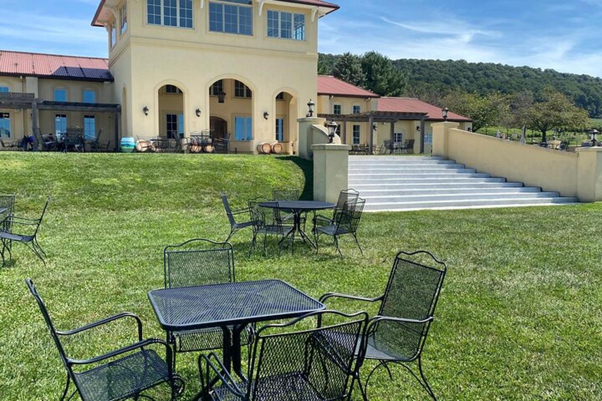 a group of tables and chairs in front of a building