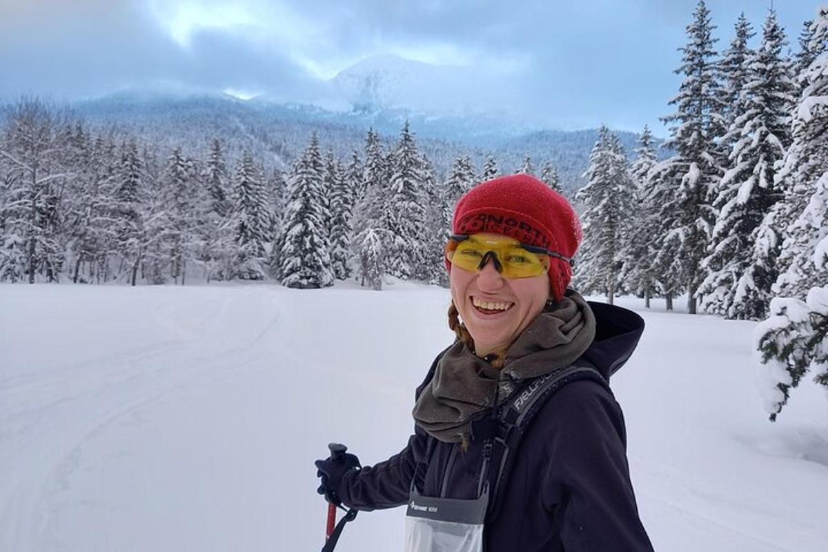 a woman standing on skis in the snow
