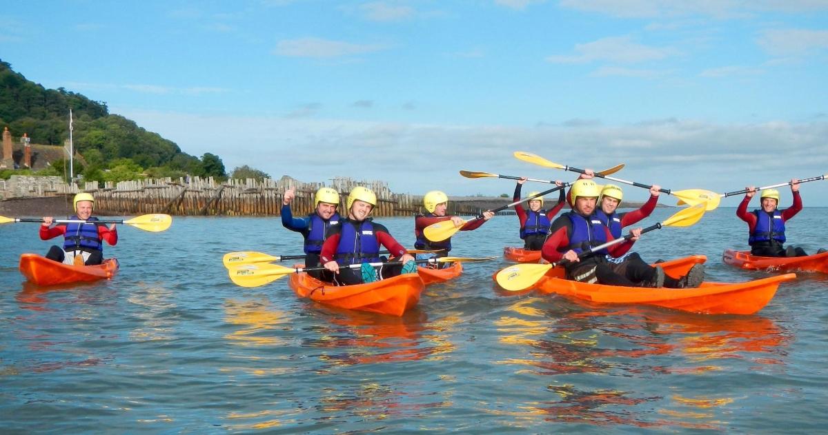a group of people in kayaks on the water