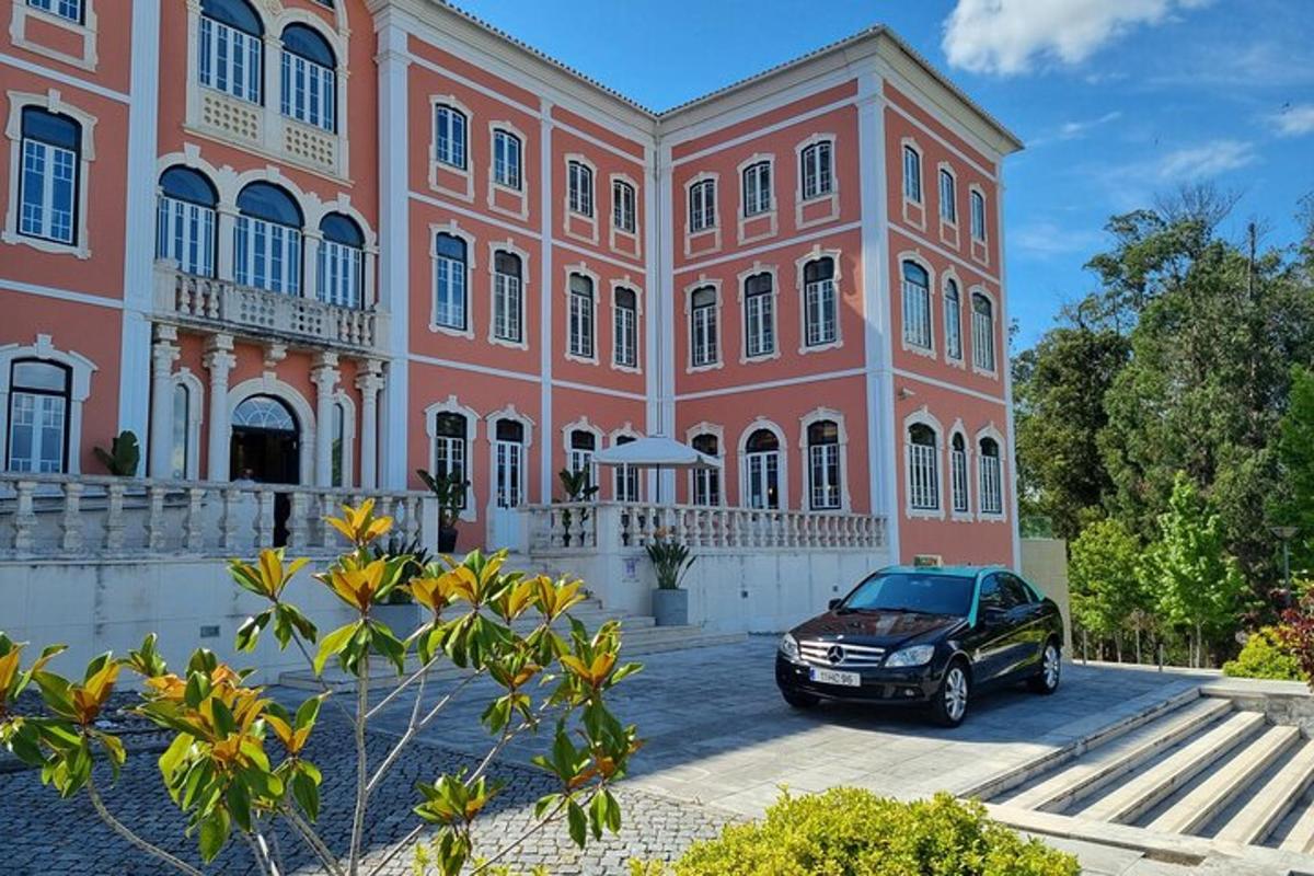 a car parked in front of a large building