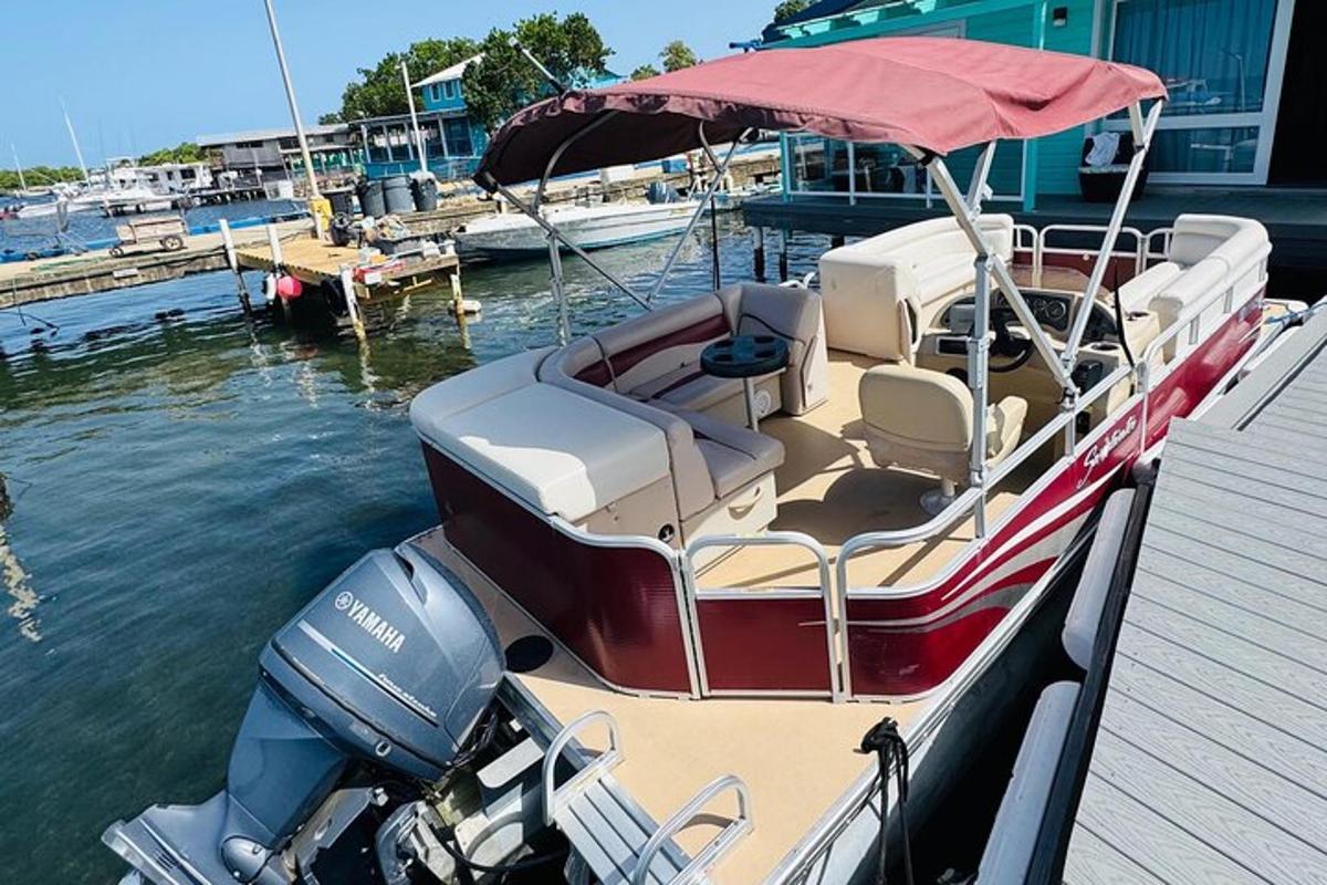a small boat parked at a dock in the water