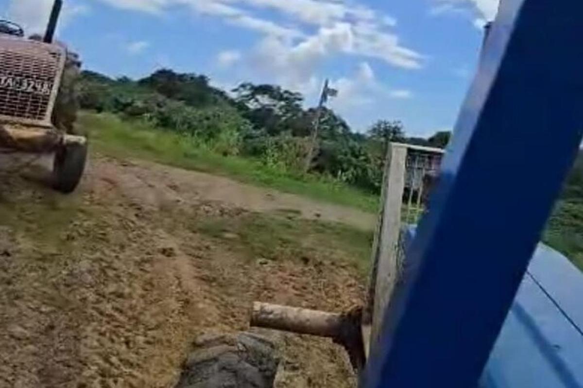 a view of a dirt road from a vehicle