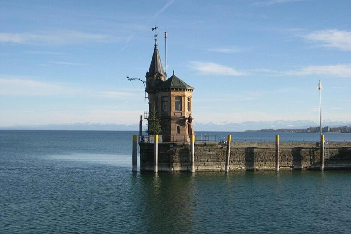 a lighthouse on a pier in the water