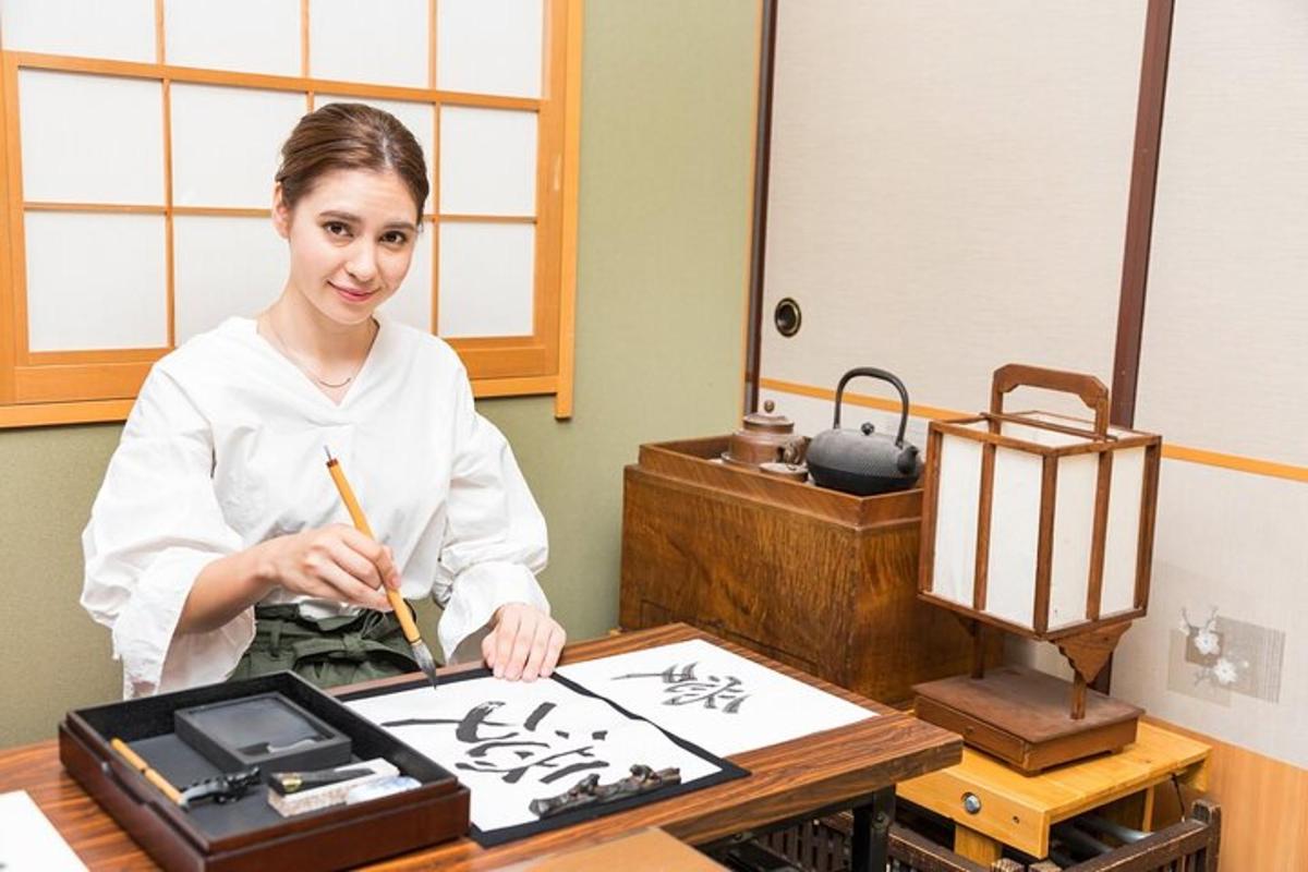 a woman holding a chopstick in front of a table