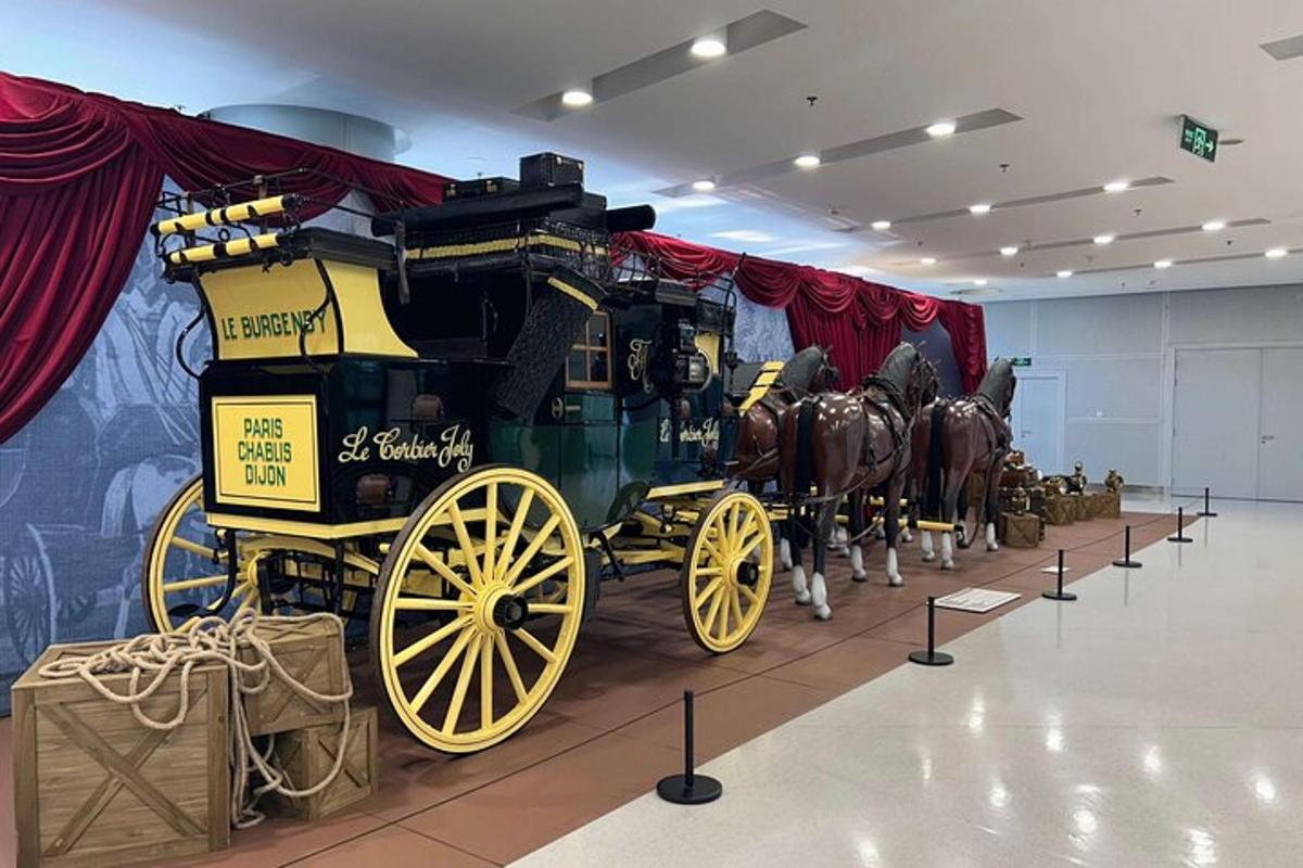 a horse drawn carriage on display in a museum