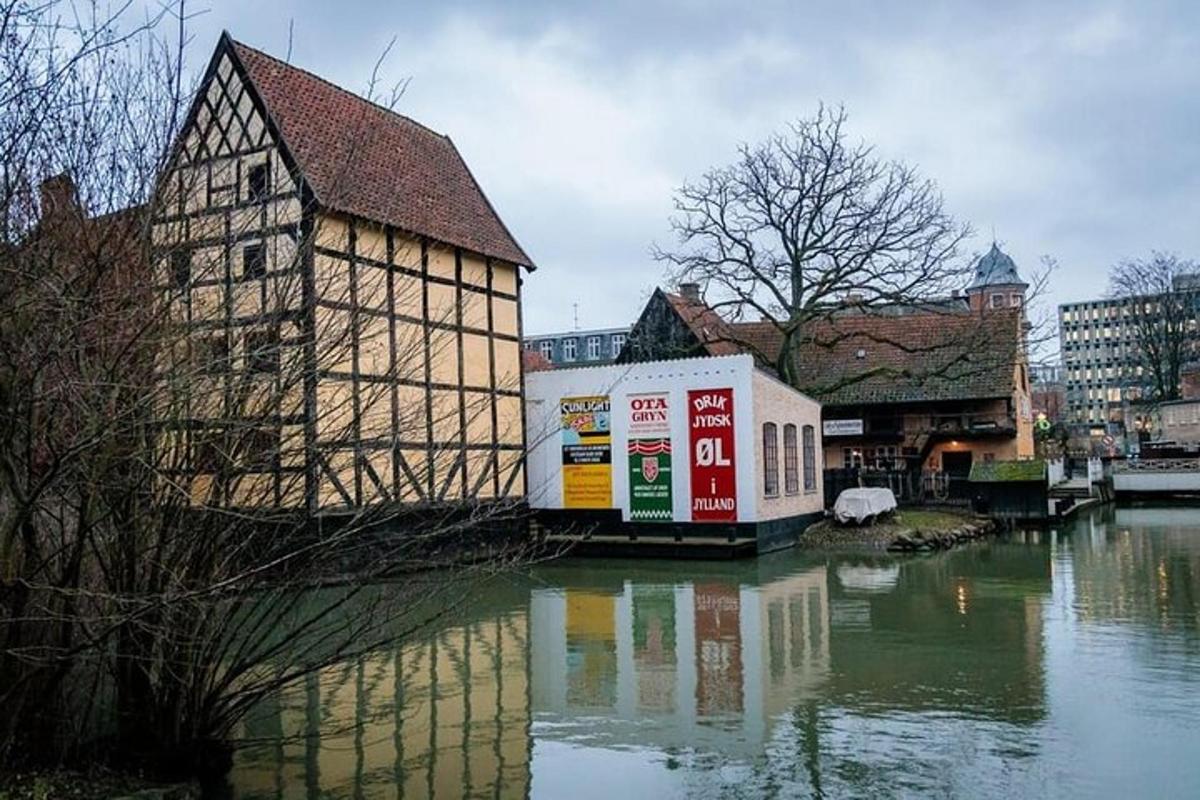 a building on the side of a river with water