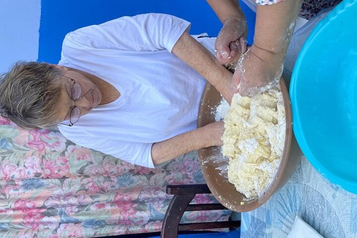 a woman laying on a bed with a bowl of food
