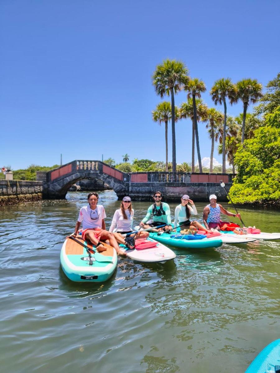 a group of people on paddle boards in the water