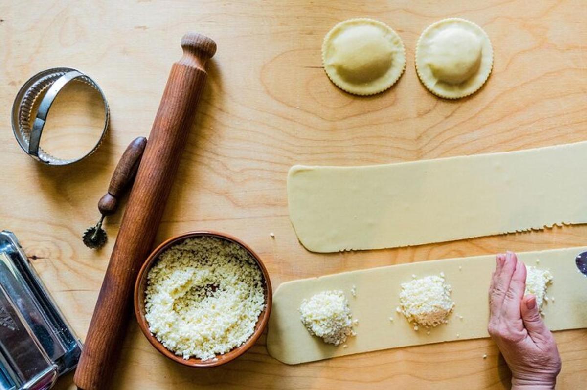 a cutting board with a knife and a bowl of food