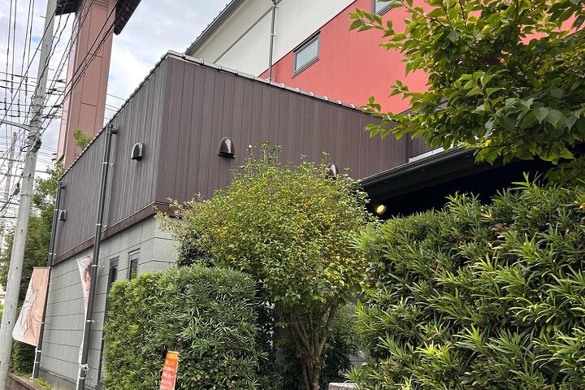 a building with a bunch of bushes in front of it