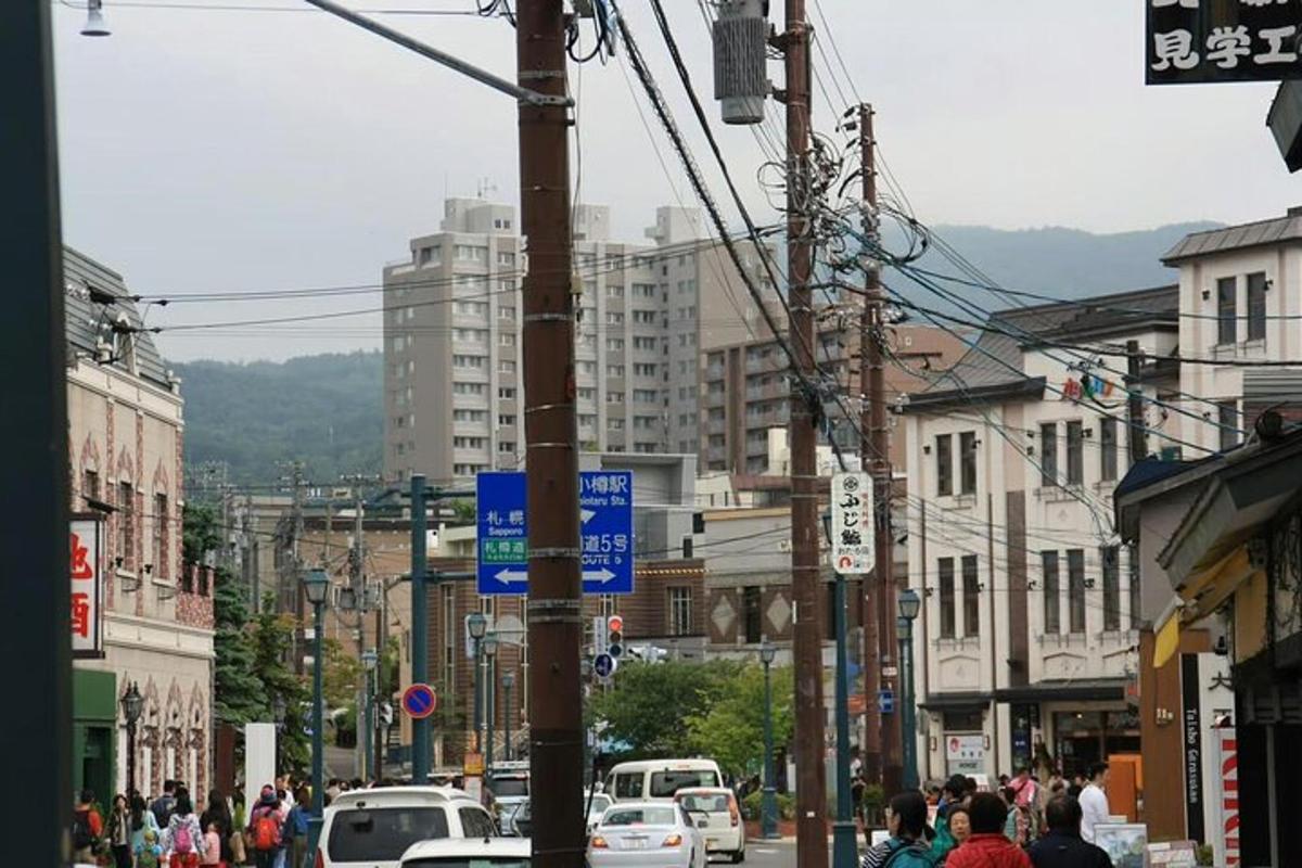 a busy city street with cars and people on the street