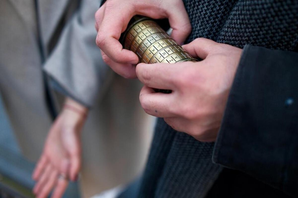 a man holding a small object in his hands