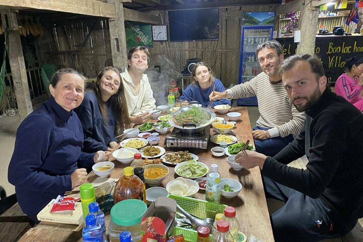 a group of people sitting around a table eating food