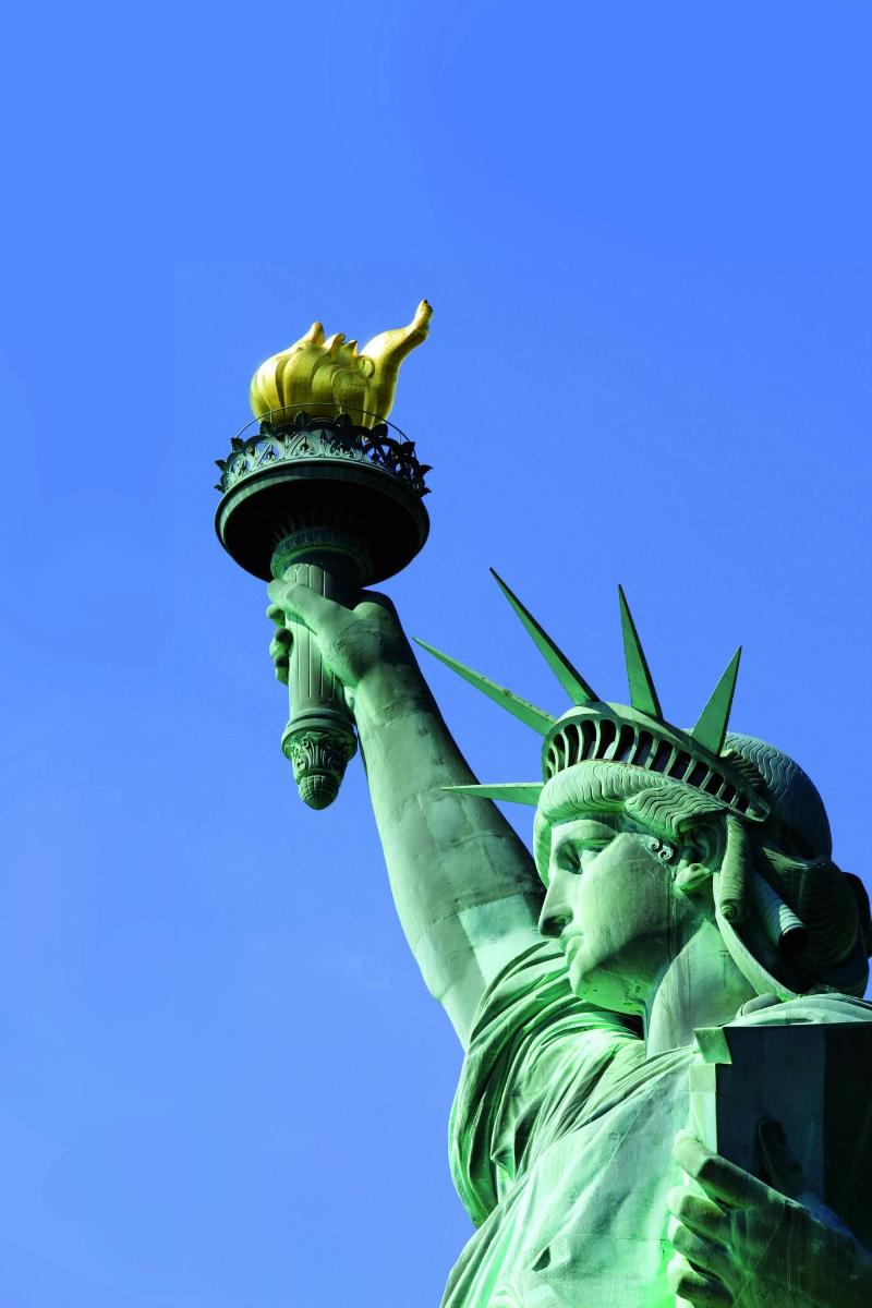 the statue of liberty with a banana on top of it