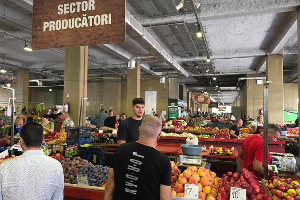 a group of people standing in a produce section of a market