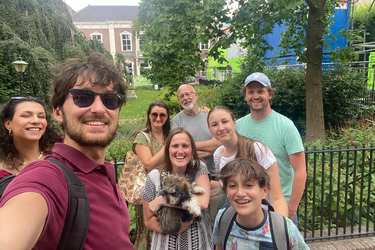 a group of people posing for a picture with a dog