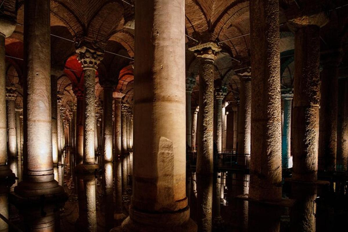 a row of columns in a building with a ceiling