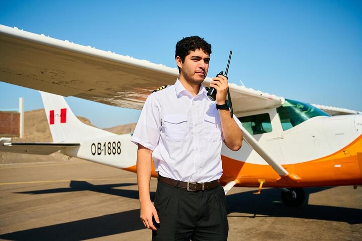 a man is standing in front of a small plane