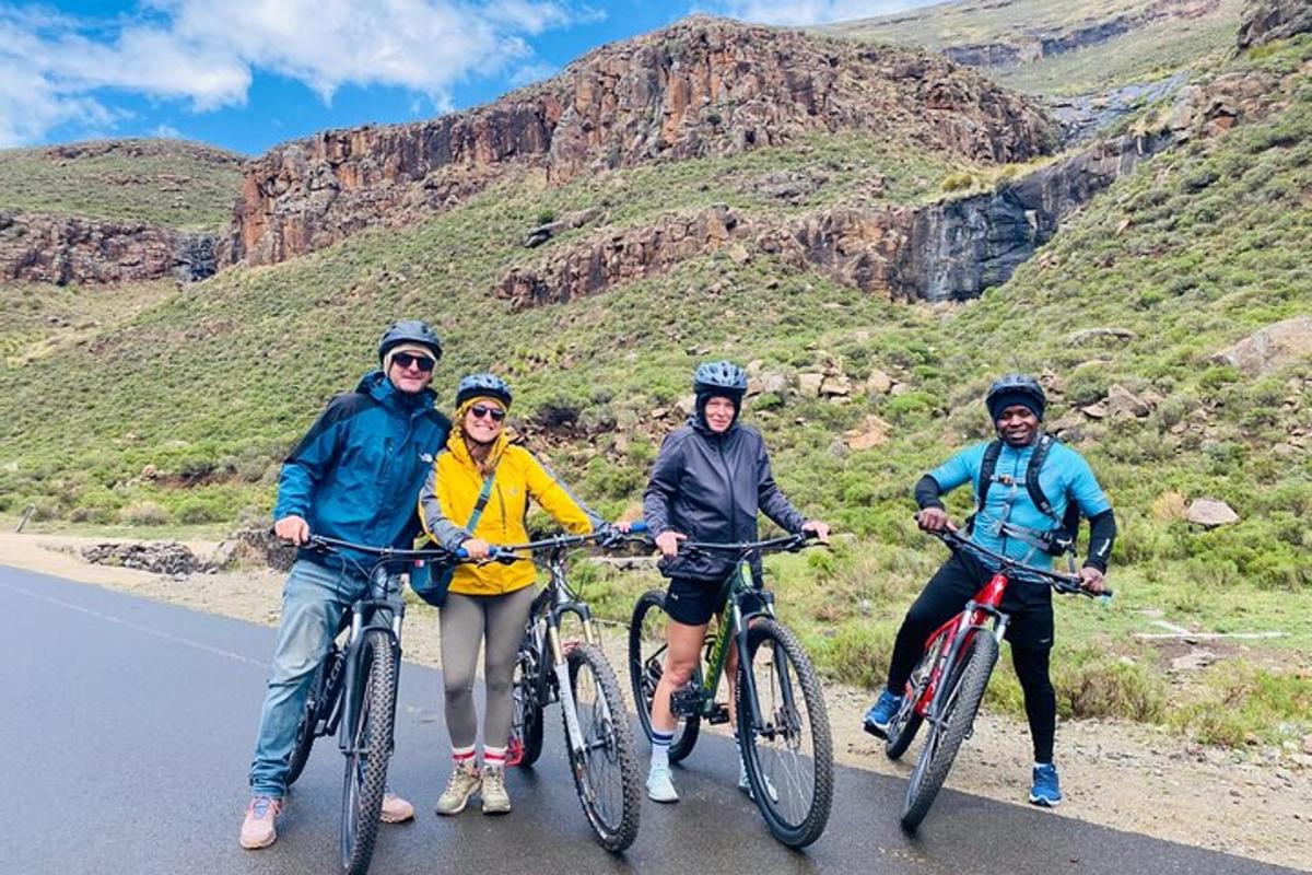 a group of people riding bikes on a road