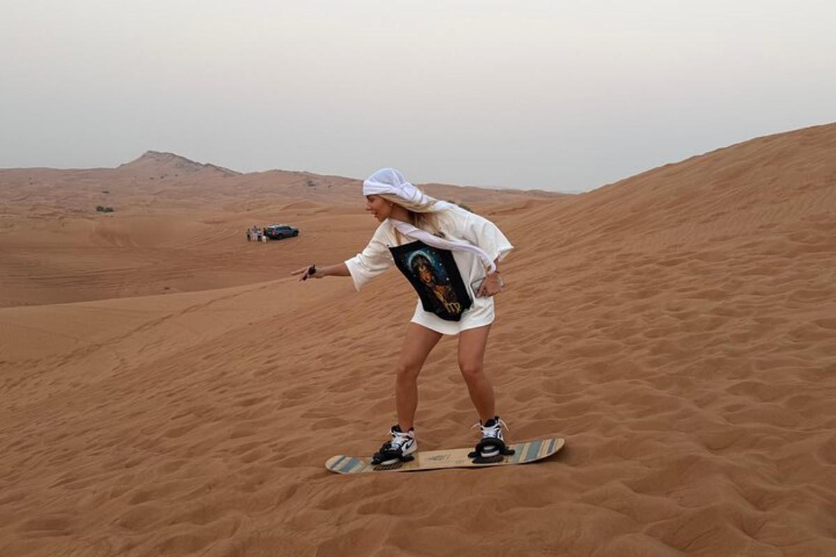 a woman on a snowboard in the desert