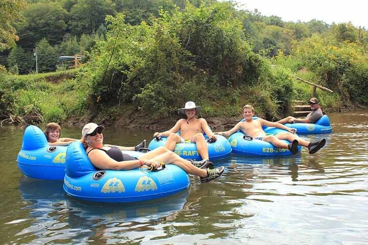 a group of people riding on rafts on a river
