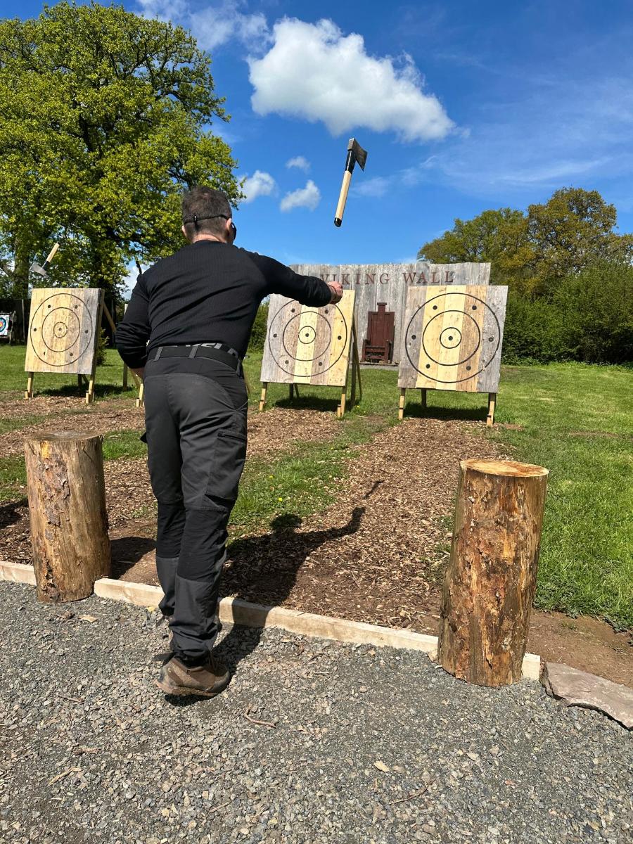 a man is flying a kite in a park