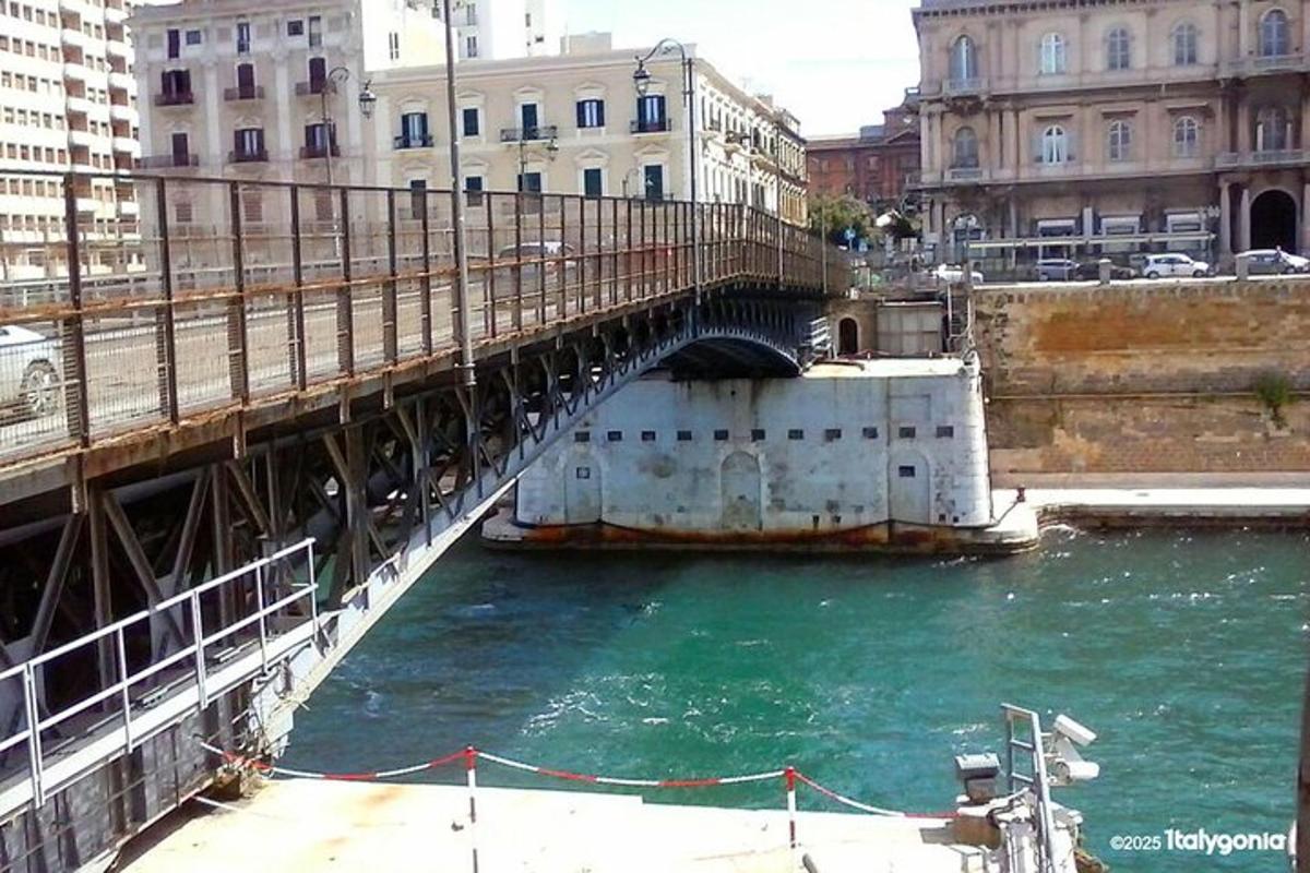 a bridge over a river in a city with buildings