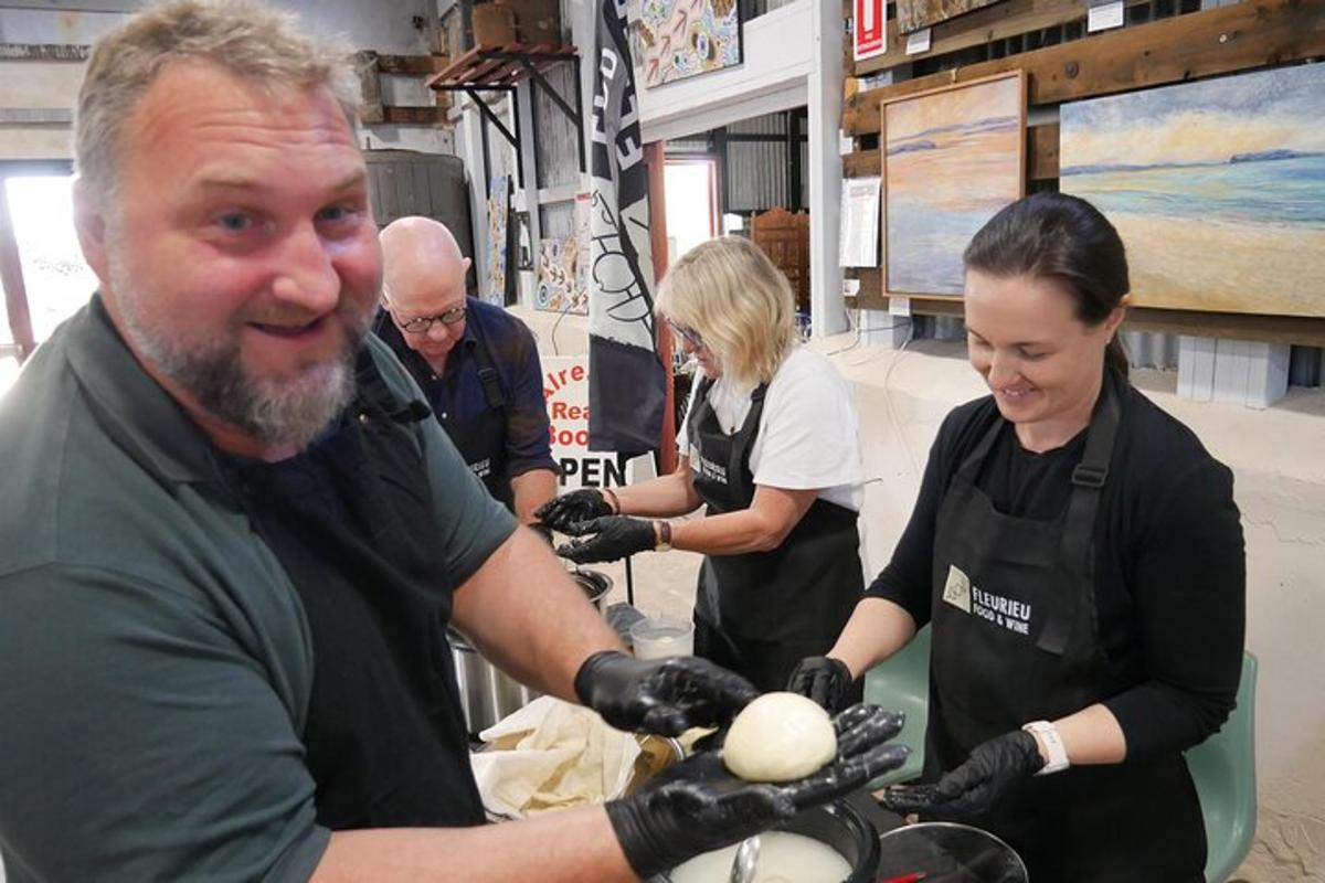 a group of people preparing food in a store
