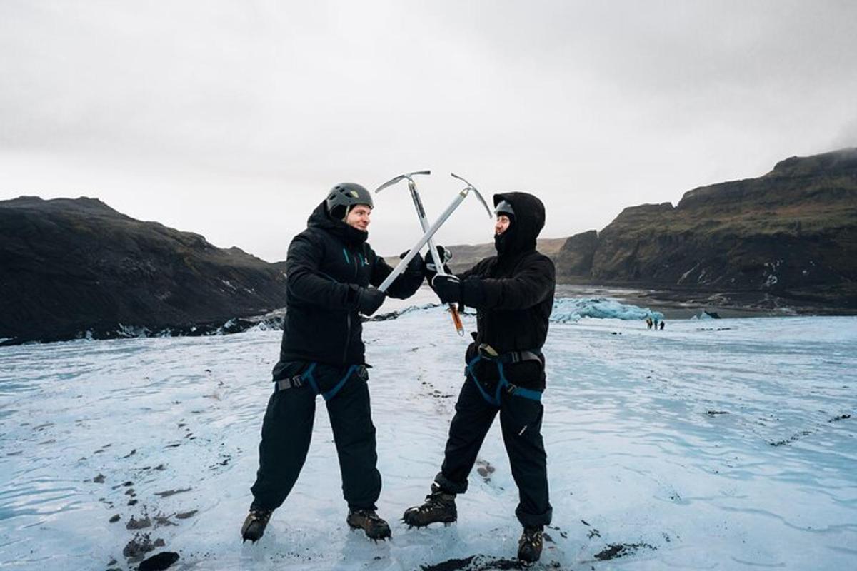 two men are holding onto ski poles in the snow