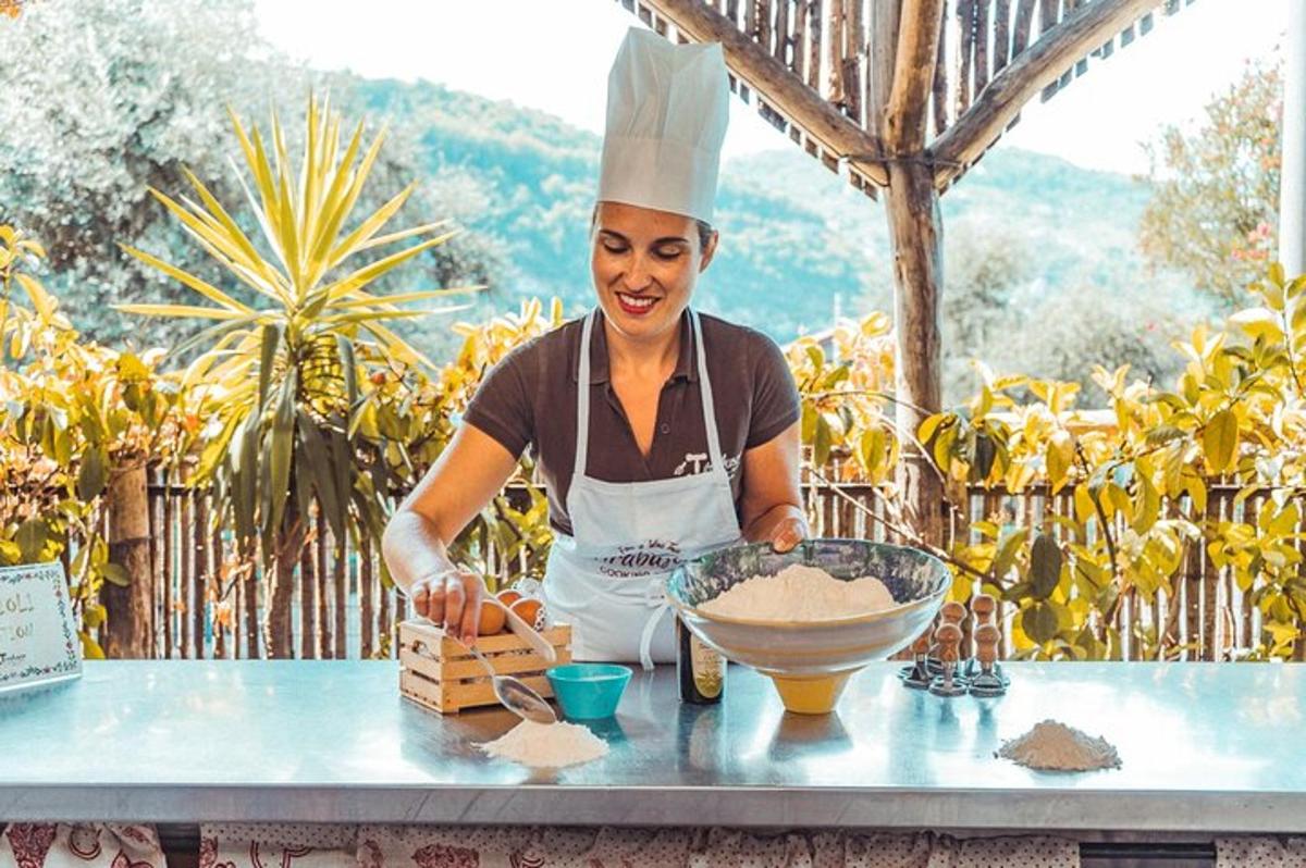 a woman in a chef hat preparing food on a table