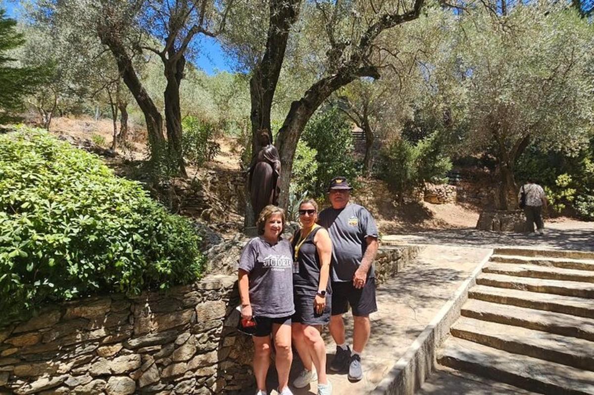 a group of people standing in front of a statue