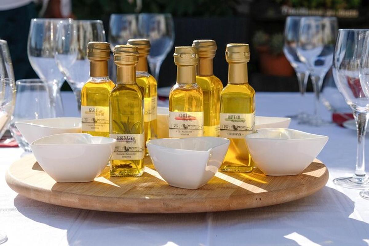 a wooden tray with bottles of oils on a table