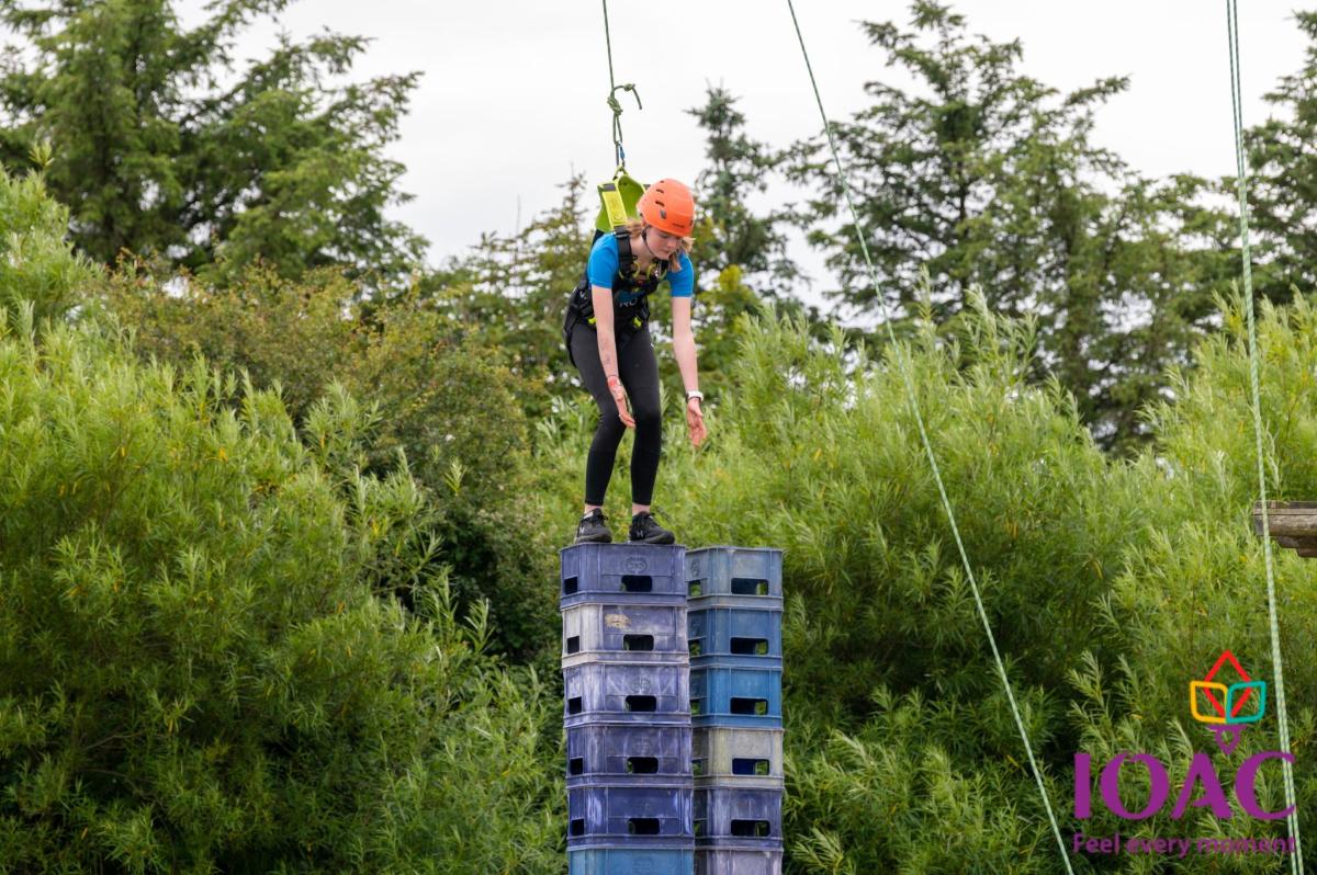 a man is standing on top of a building