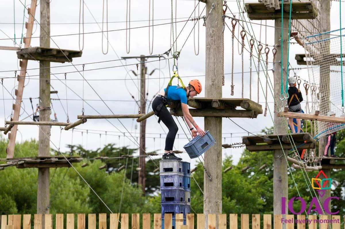 a man is standing on top of some electrical wires