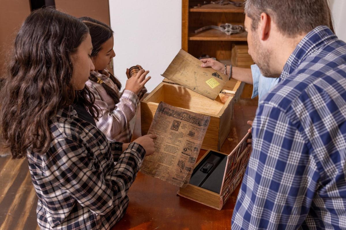 a group of people standing around a box