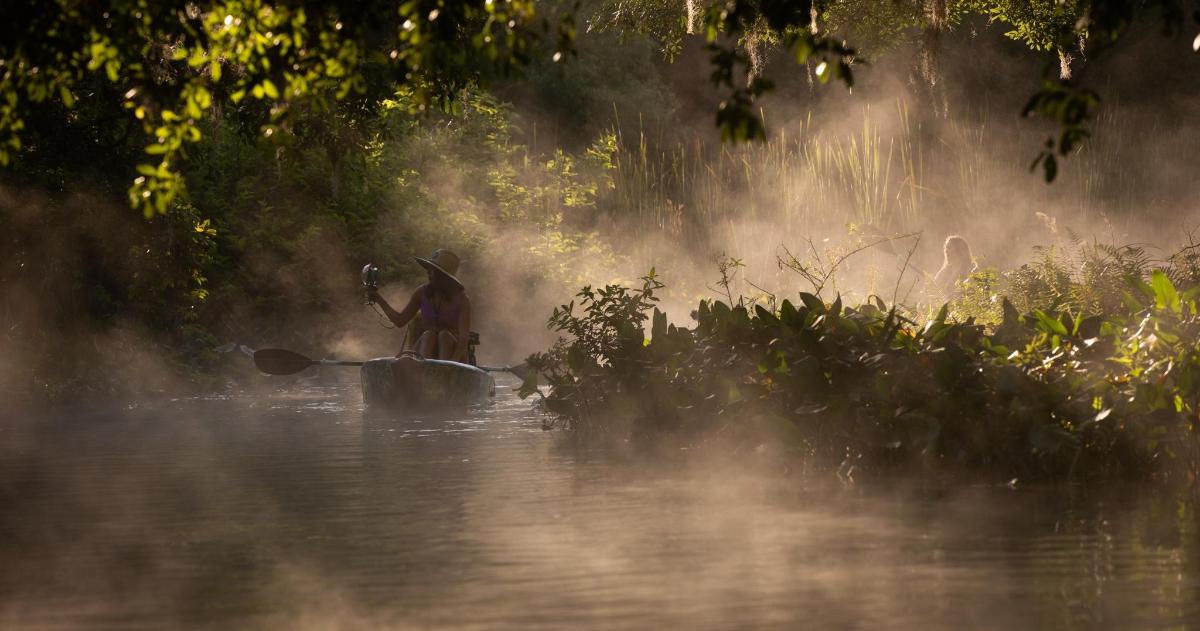a person on a boat in the water